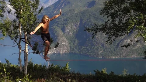 Hanging by a thread: Tightrope walker achieves 35m high stunt in