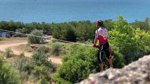 A man is walking a slackline. Stock Footage 113800357