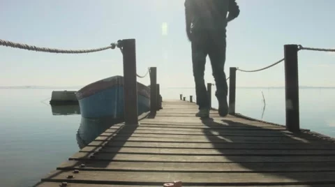 Man walking on the small bridge Stock Footage 62402730
