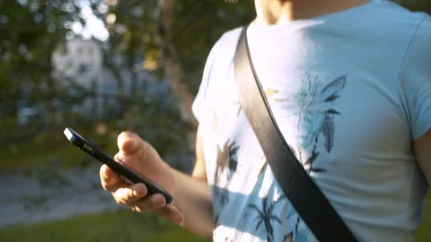 Man walking with smart phone Stock Footage 114627672