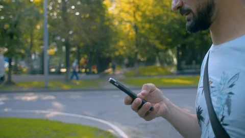Man walking with smart phone Stock Footage 114627801