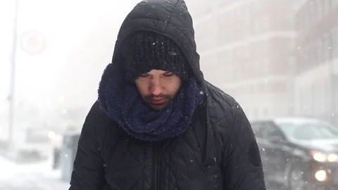 Man Walking on Snow in Brooklyn during snowstorm Manhattan New York City usa Stock Footage 84740184