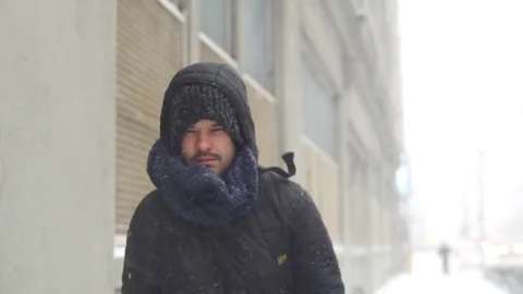 Man Walking on Snow in Brooklyn during snowstorm Manhattan New York City usa Stock Footage 84740478