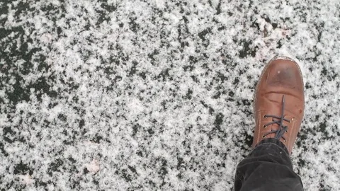 Man Walking on Snow-Covered Track Stock-Footage 71775095