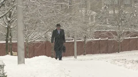 Man walking on snow Stock Footage 10710749