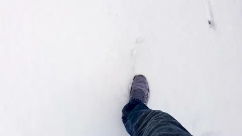 Man walking in snow Video stock 148389389