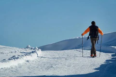 Man walking on snow Stock Photos