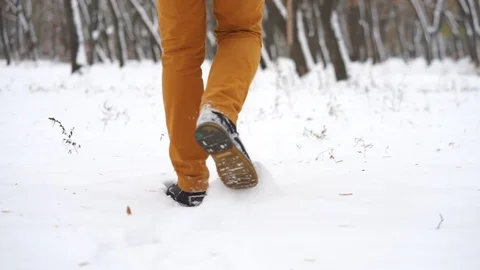 Man walking on snow, white winter Stock Footage 98737006