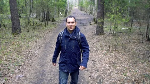 Man Walking in Spring Forest Stock Footage 76195033