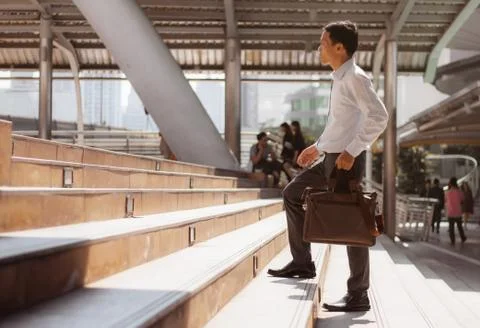 Man walking up stair. Stock Photos