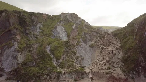Man walking up steps at beach Stock Footage 91772338