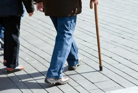 Man with walking stick Stock Photos