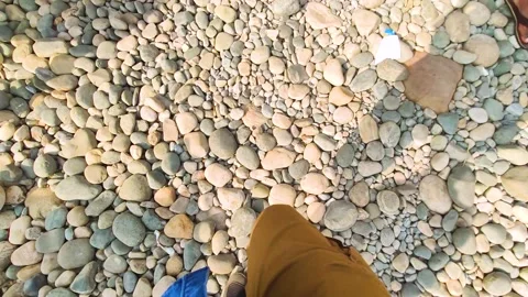 A man walking on stone Stock Footage 275395607