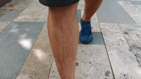 Man walking on a stone pavement Vidéo 310310127