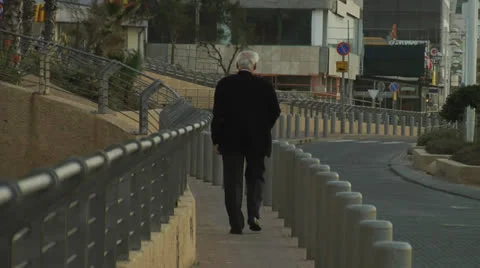 Man Walking in street Stock Footage 25179100