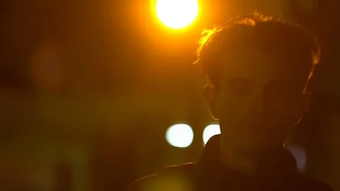 Man walking on the street at the night. Slow motion. Stock Footage 80307092
