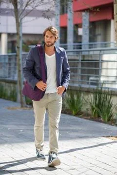 Man walking on a street Stock Photos