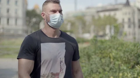 Man walking on the street with protective face mask on Video stock 140104427