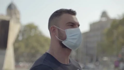 Man walking on the street with protective face mask on Video stock 140104884