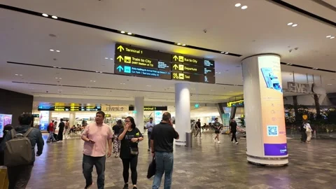 A man is walking with a suitcase and a backpack Stock Footage 315682685