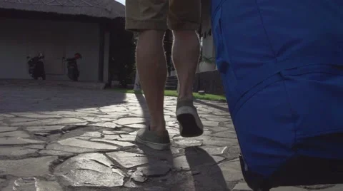 Man walking with a suitcase at hotel Video stock 65826743
