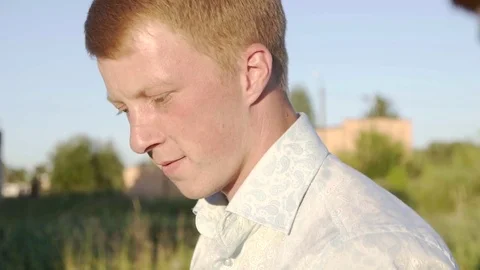 Man walking on a sunset smiling slow mo Stock Footage 82970021