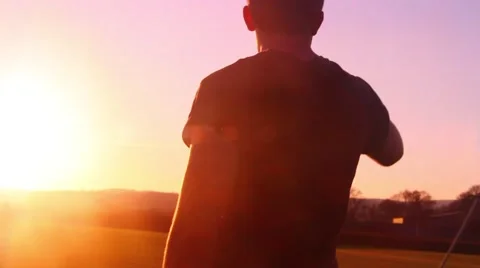 Man walking at sunset tracking 動画素材 48896827