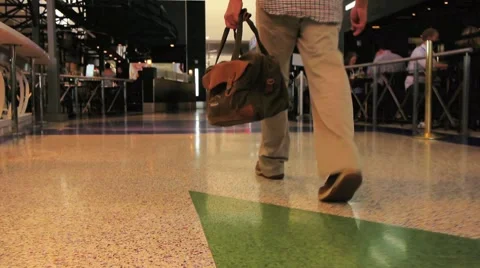 Man Walking through Airport with Bag Stock Footage 1045683
