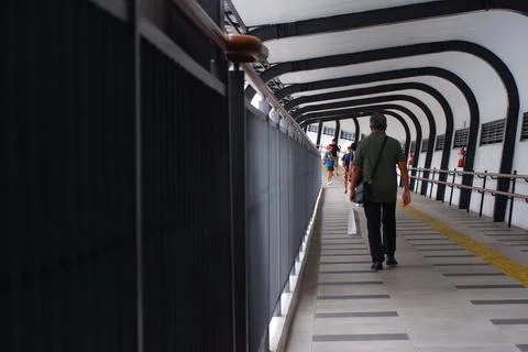 Man Walking Through Arched Covered Bridge at Lebak Bulus MRT Station Jakarta Stock Photos
