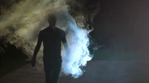 The man walking through the cloud of Stock Video Pond5