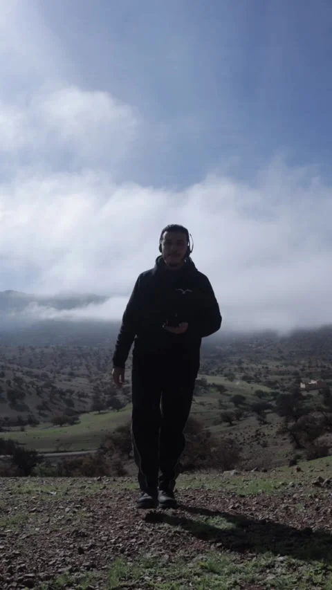 Man Walking Through Clouds on Mountain, Ait Issafen, Morocco Stock Footage 332776308