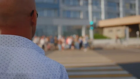 Man walking through the Crowd of People in the Big City. Crossing the street Stock Footage 112595252
