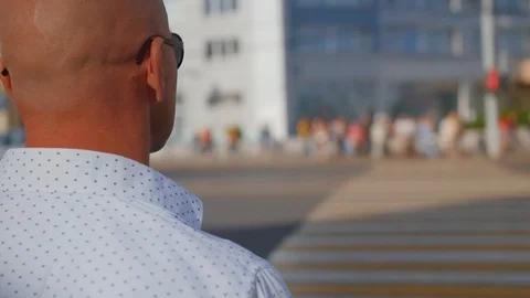 Man walking through the Crowd of People in the Big City. Crossing the street Stock Footage 112612024