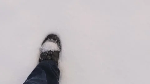 Man Walking Through Deep Snow with Heavy Steps Stock Footage 294349117