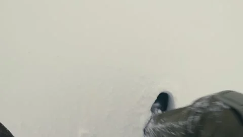 Man Walking Through Deep Snow in Winter Landscape from Above Stock Footage 316303092