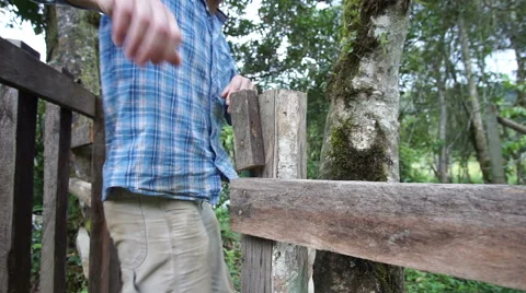 Man Walking Through Gate Going Video stock 53607998
