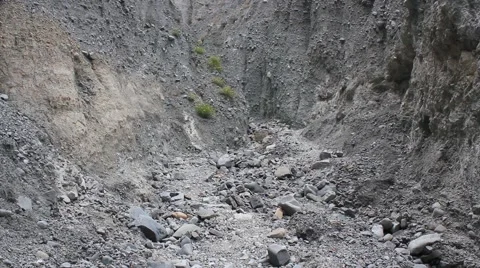 Man walking through Grey Rock Formation Stock Footage 47429166