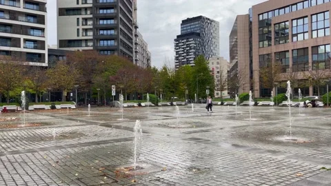 A man walking through the Jean Rey Square at Etterbeek district in Brussels Stock Footage 225922140