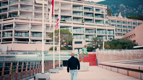 Man walking through the La Condamine harbour in the Monaco Marina Stock Footage 295689333