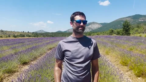 Man Walking Through Lavender Field, Tracking Shot Stock Footage 338007120