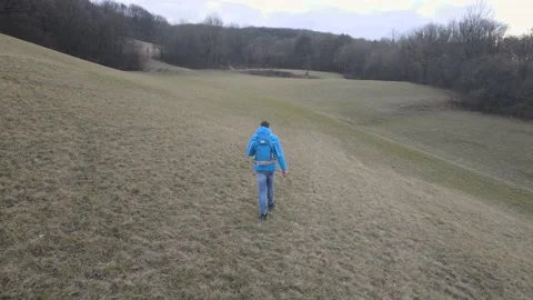 Man walking through meadow 2021 jan 25 006 Stock Footage 147375768