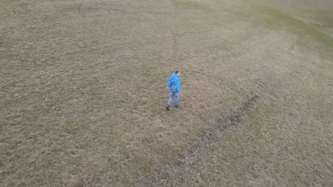 Man walking through meadow 2021 jan 25 004 Stock Footage 147375889