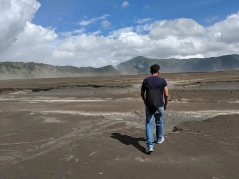 A man walking through Mount bromo an active volcano Stock Photos
