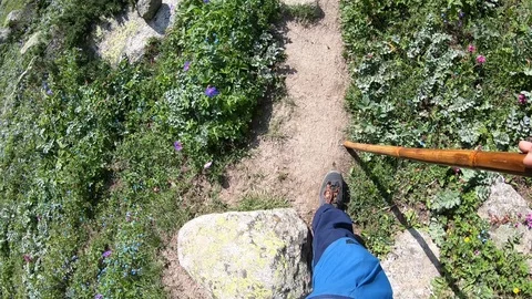 Man Walking through the mountain terrain. Stock Footage 124942254