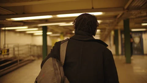 Man walking through New York City subway during the evening rush hour Stock Footage 312579257