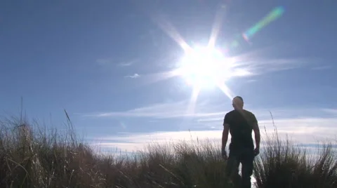 Man Walking Through Ocean Dunes 1 Video stock 48192014