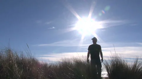 Man Walking Through Ocean Dunes 2 Stock-Footage 48192876