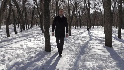 Man is walking through the park Stock Footage 88164114