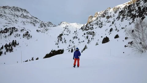 Man walking through the snow Stock Footage 102851712