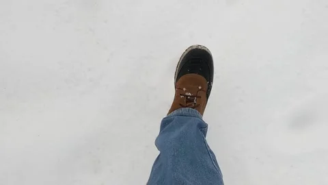 Man walking through the snow Stock Footage 326609654